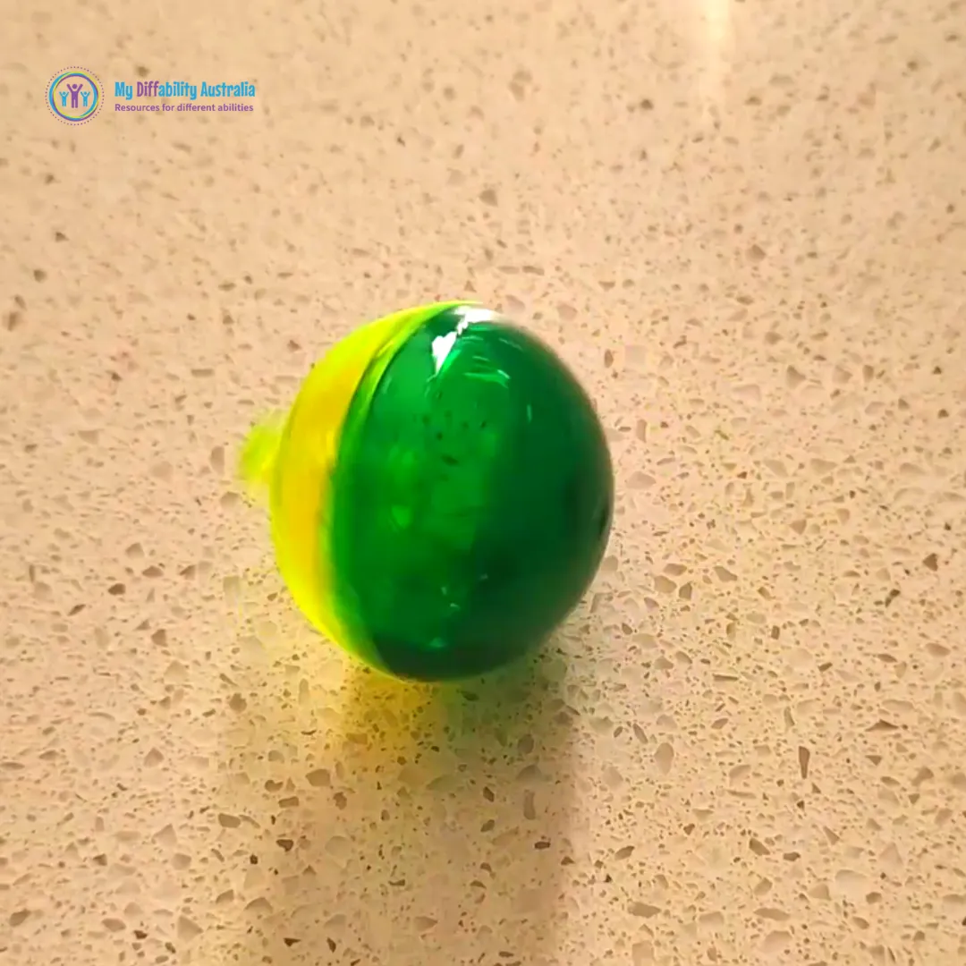 Flip over glitter spinning top